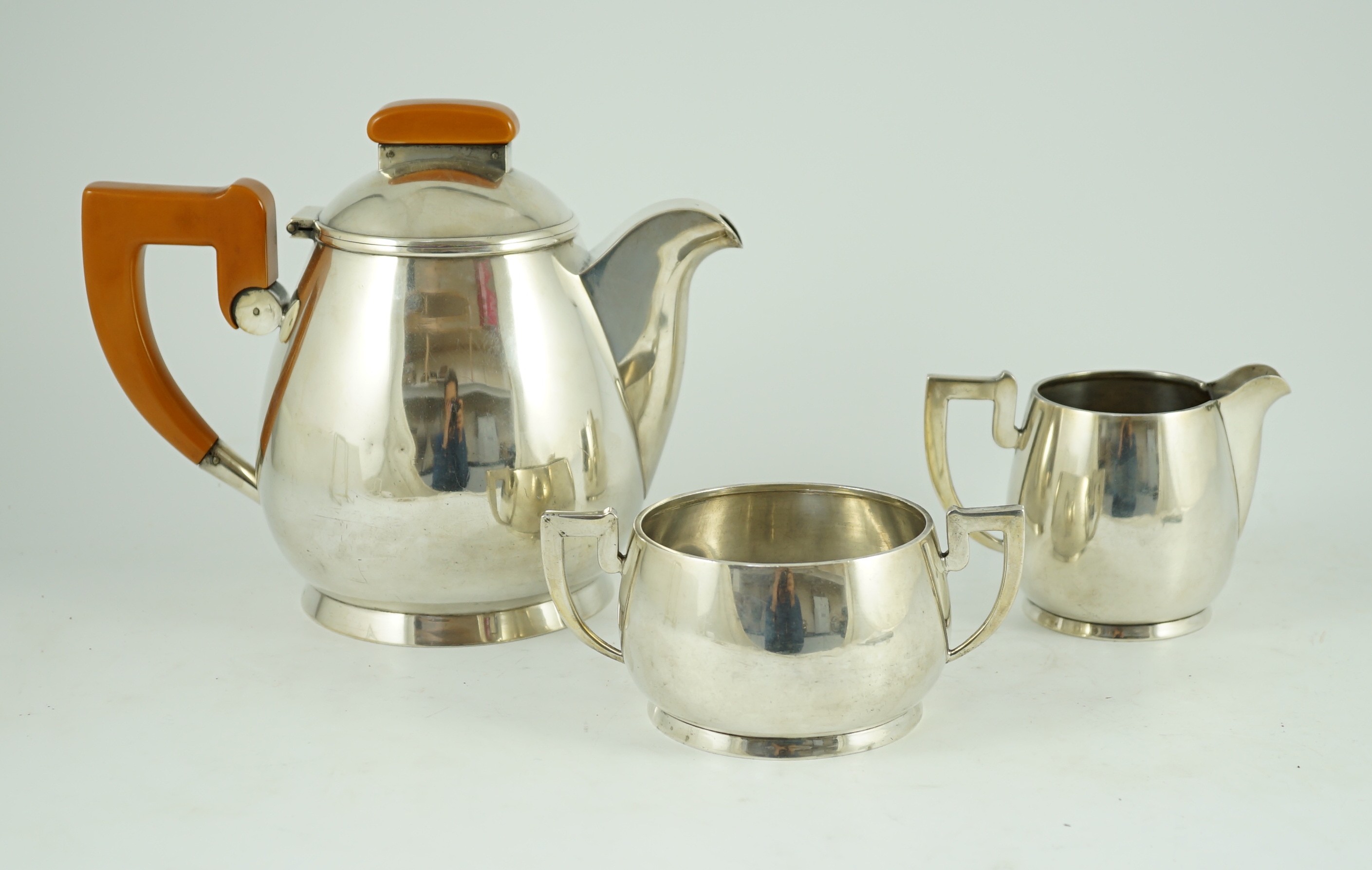 A stylish George VI silver three piece tea set, by Ls Sl